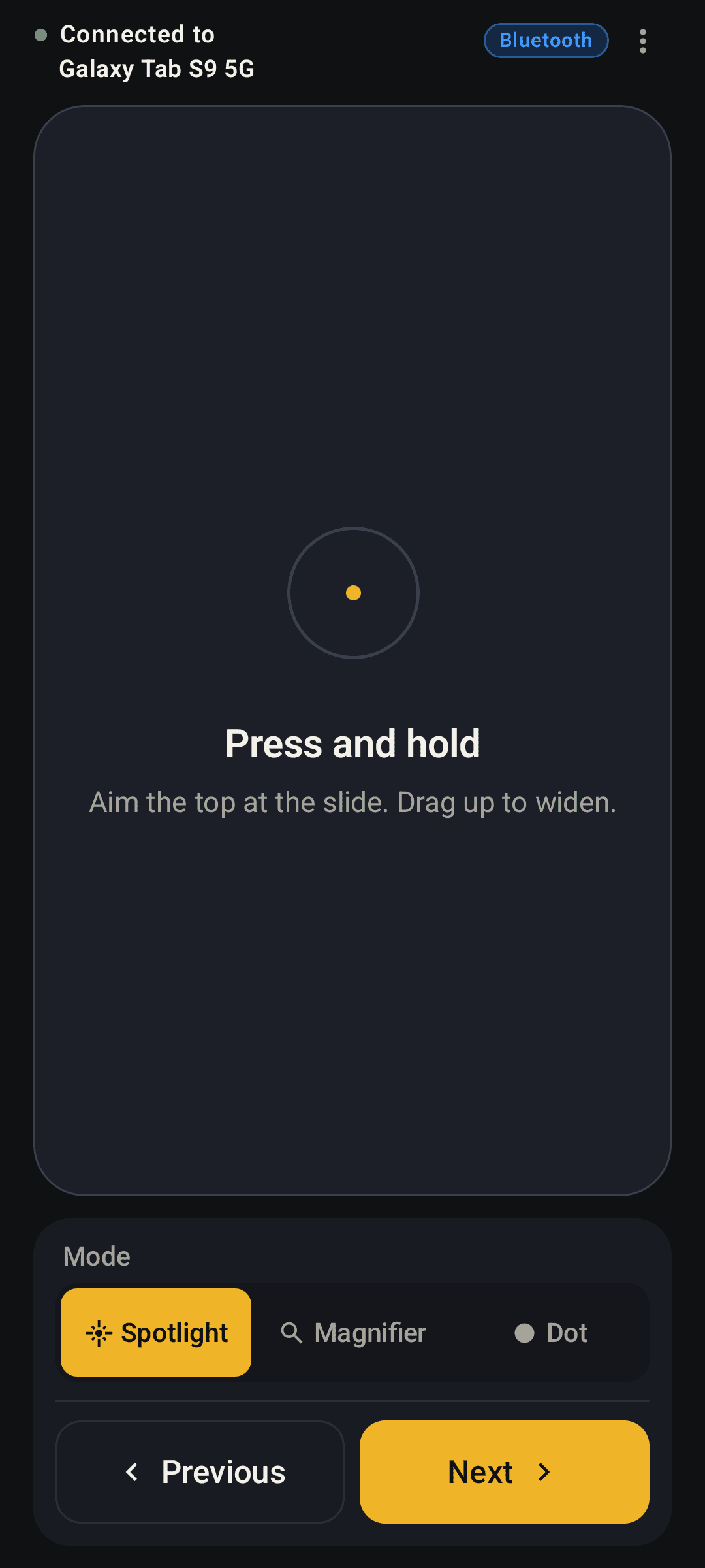 Slide Spotlight remote: pad, spotlight, and previous and next buttons.